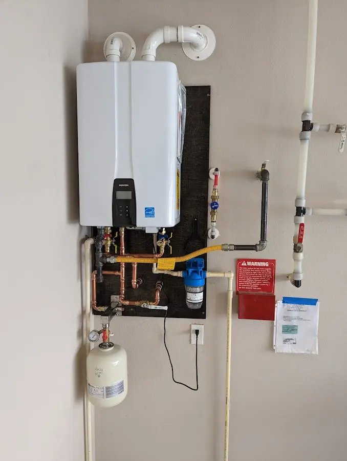 Professional plumber installing copper piping in a Crooked River Ranch home